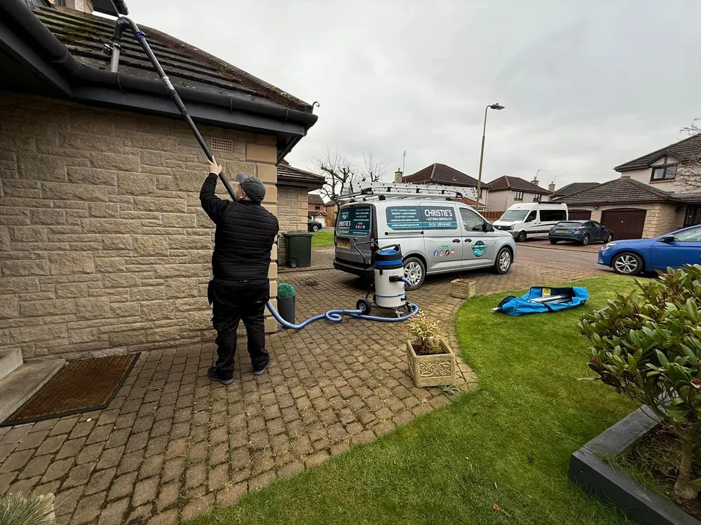 Christie's Exterior Cleaning on site — gutter vacuuming, water-fed pole cleaning and the team at work