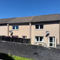Working at roof and downpipe level on a terraced property