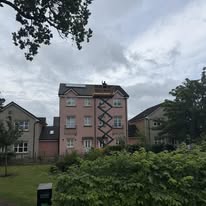 Fascia and soffit level of a rendered block of flats