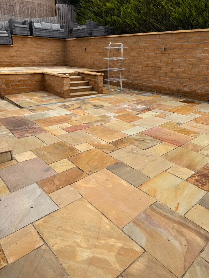 Indian sandstone patio cleaned back to its original colour